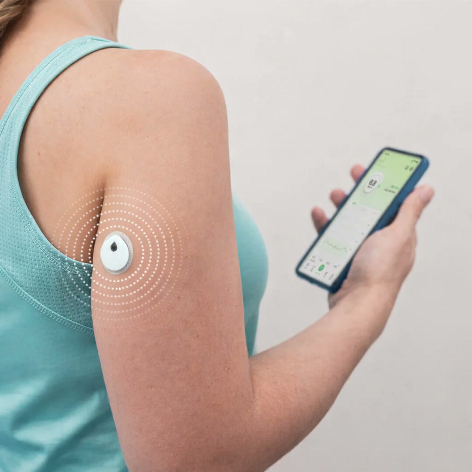 The LinX sensor worn on the back of the upper arm, paired to a phone